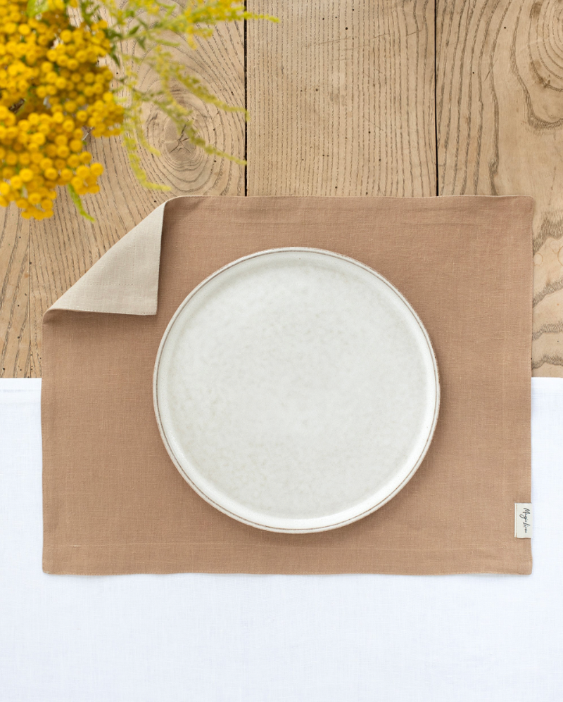 MagicLinen - Double Layer Linen Placemat Set of 2: Latte, featuring a soft linen placemat on a wooden table, ideal for dining decor and table protection.
