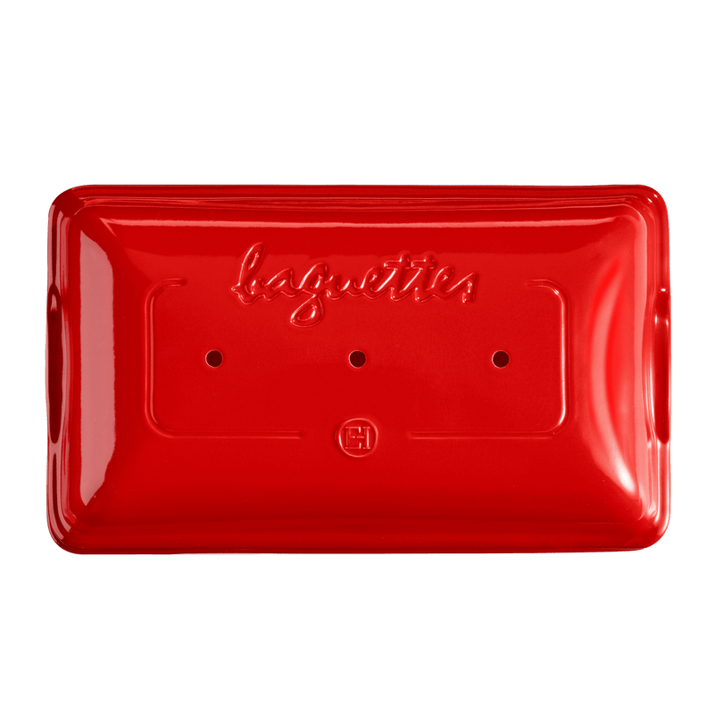 Emile Henry | Baguette Baker, Burgundy: Rectangular ceramic mold with baguettes embossed, three steam holes, and maker's logo, designed for easy homemade baguette baking.