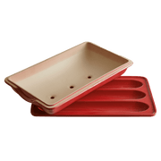 Emile Henry | Baguette Baker: A red and white rectangular baking dish ideal for crafting perfect homemade baguettes, featured with three spoons for versatile kitchen use.