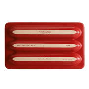 Emile Henry | Baguette Baker featuring a red tray with white writing, designed for artisan bread baking, aligning with Athens Cooks' high-quality kitchenware offerings.