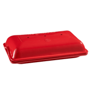 Emile Henry Baguette Baker, a red plastic container with a lid, designed for baking perfect baguettes.