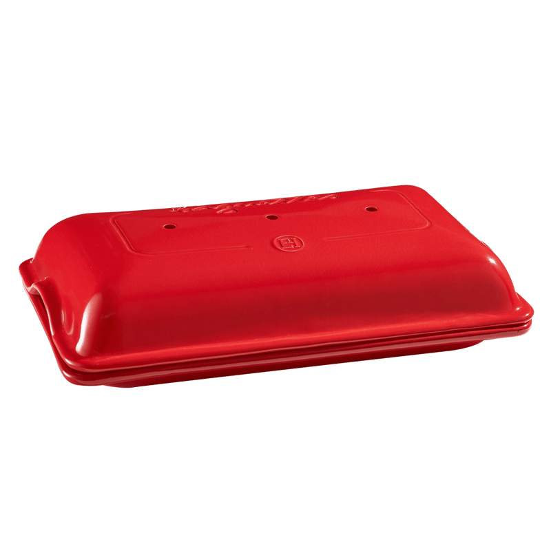 Emile Henry Baguette Baker, a red plastic container with a lid, designed for baking perfect baguettes.