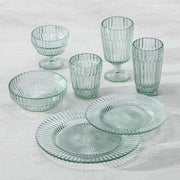 Fortessa | Archie Verde 10.6 Dinner Plate set among various glassware, showcasing elegant serveware for sophisticated dining.