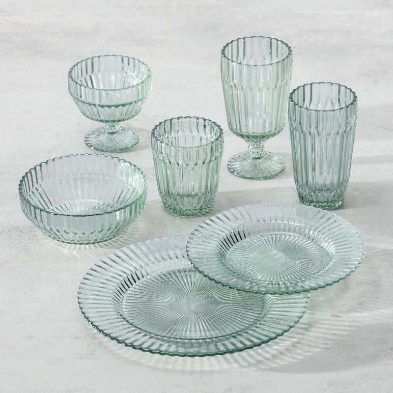 Fortessa | Archie Verde 10.6 Dinner Plate set among various glassware, showcasing elegant serveware for sophisticated dining.