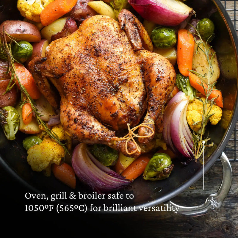 Hestan | Molecular Titanium Stainless Wok, 14 holding a whole roast chicken with vegetables, demonstrating its versatility and high-heat capability, ideal for diverse cooking methods.