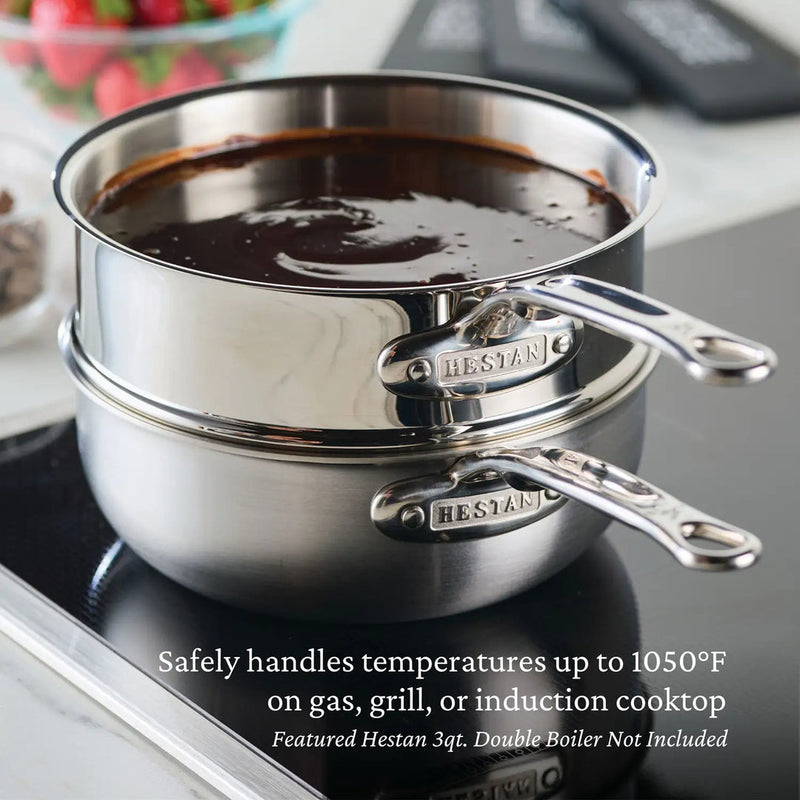 Hestan 3 qt double boiler on induction cooktop with melted chocolate. Featured product: Hestan | Cookware, 2qt Saucier Pan + Lid for efficient sauce-making.