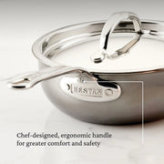 Hestan | Cookware, 2qt Saucier Pan + Lid, featuring a chef-designed ergonomic handle, highlighted for comfort and safety, with a robust molecular titanium surface.