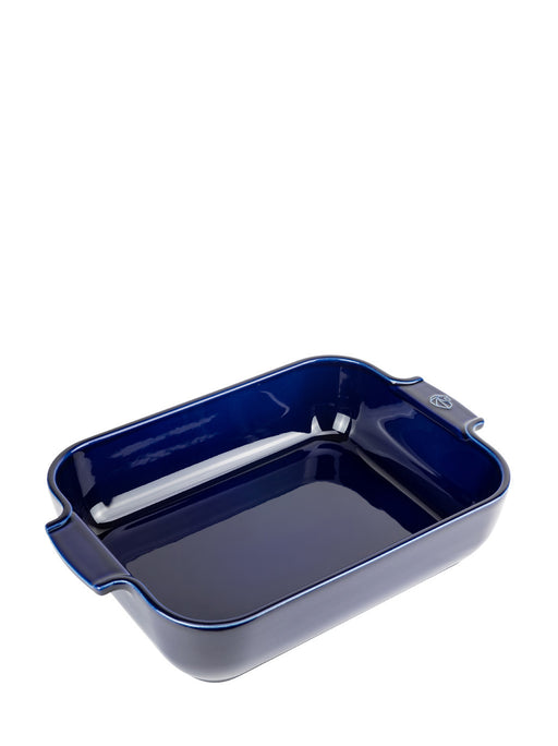 Peugeot | Appolia Rectangular Baking Dish, Blue: A 32 cm navy-blue ceramic dish with short handles, ideal for cooking flavorful oven meals, sold by Athens Cooks.