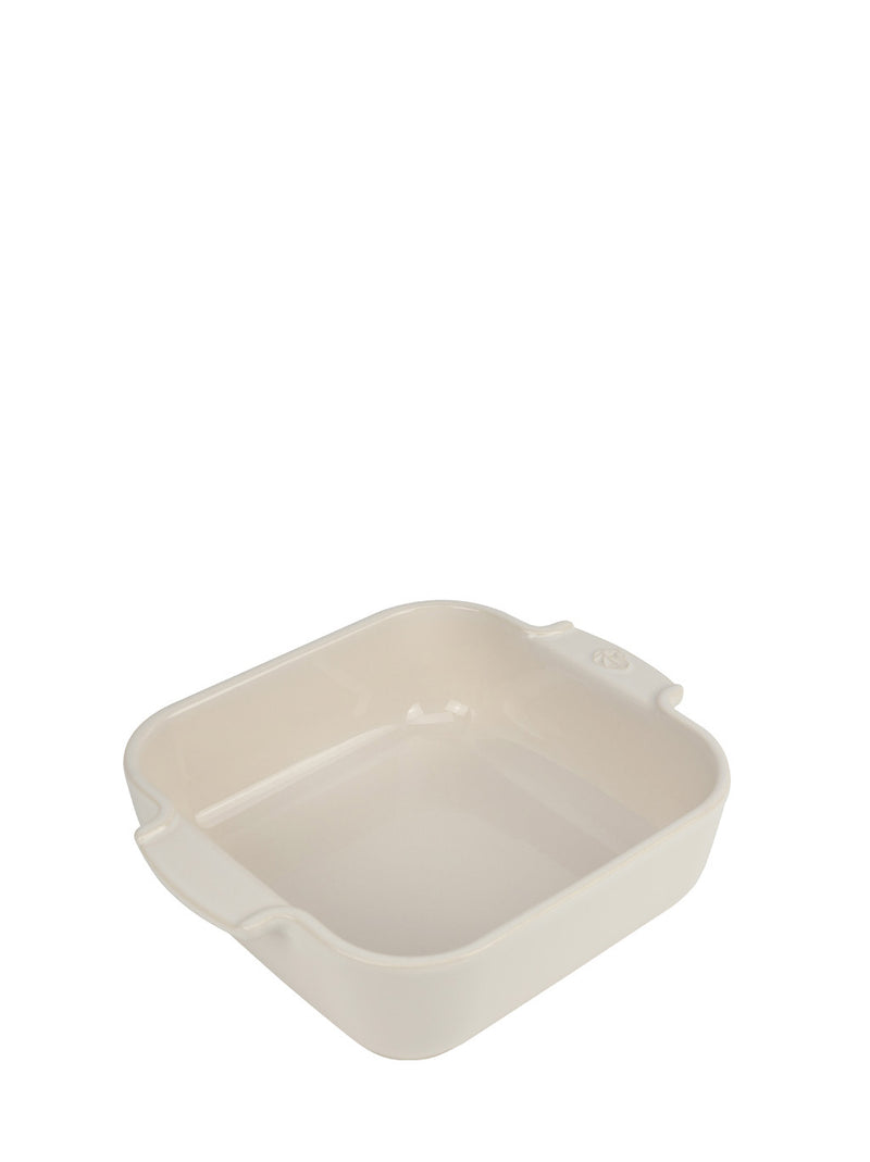 Peugeot | Appolia Square Baking Dish 8 inches, Ecru, featuring a cream ceramic design with rounded corners and small handles, ideal for evenly cooked, healthy recipes.
