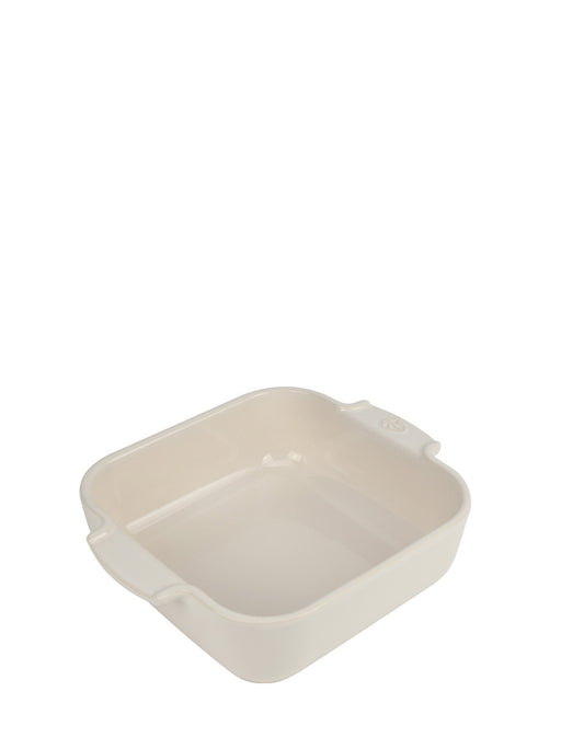 Peugeot | Appolia Square Baking Dish 8 inches, Ecru, featuring a cream ceramic design with rounded corners and small handles, ideal for evenly cooked, healthy recipes.