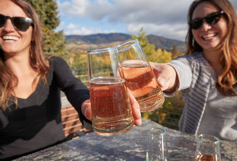Handblown Moroccan Cone Champagne Glasses set of 6, crafted from recycled wine bottles, showcasing unique shapes and bubbles, suitable for champagne or as a flower vase.