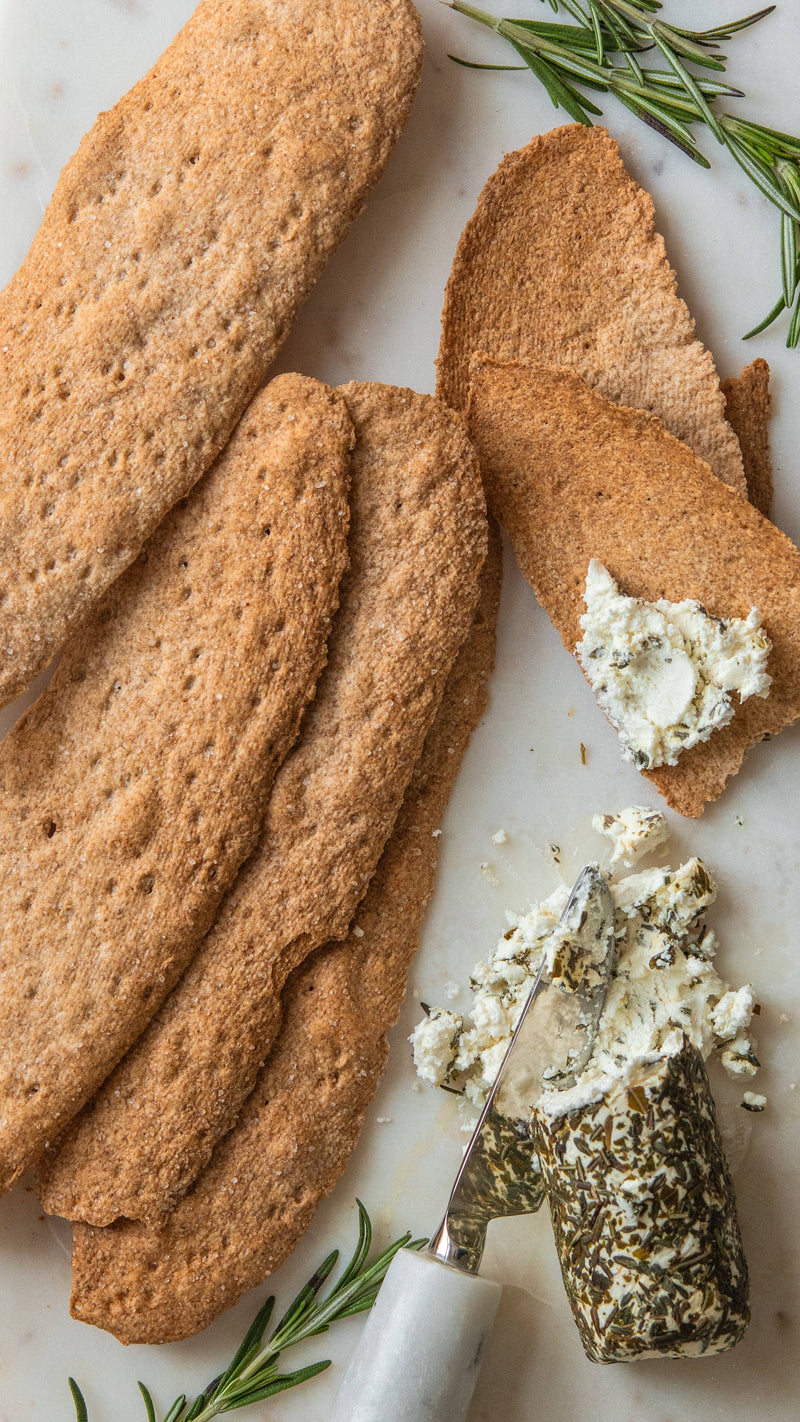 Potters Table - Salted Olive Oil Flatbreads with herbed cheese and rosemary, showcasing their rustic texture and perfect pairing for gourmet snacks or gatherings.
