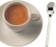 New York Demi Spoon elegantly rests beside a cup of coffee, showcasing its 4.5-inch stainless steel design, ideal for espresso or versatile kitchen use.
