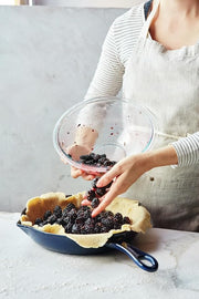 Staub Cast Iron Frying Pan - Dark Blue, ideal for versatile cooking, showcasing durable craftsmanship, perfect for any kitchen enthusiast. Available at Athens Cooks.