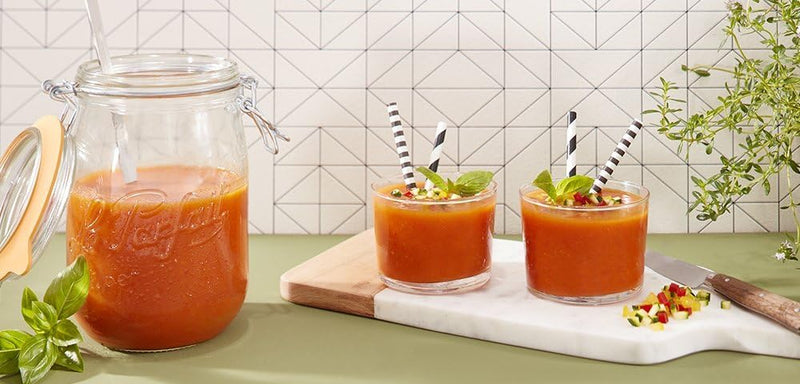 Le Parfait Super Jars, 1L with straw, shown filled with gazpacho; two tumblers on a cutting board, garnished with basil and diced veggies.