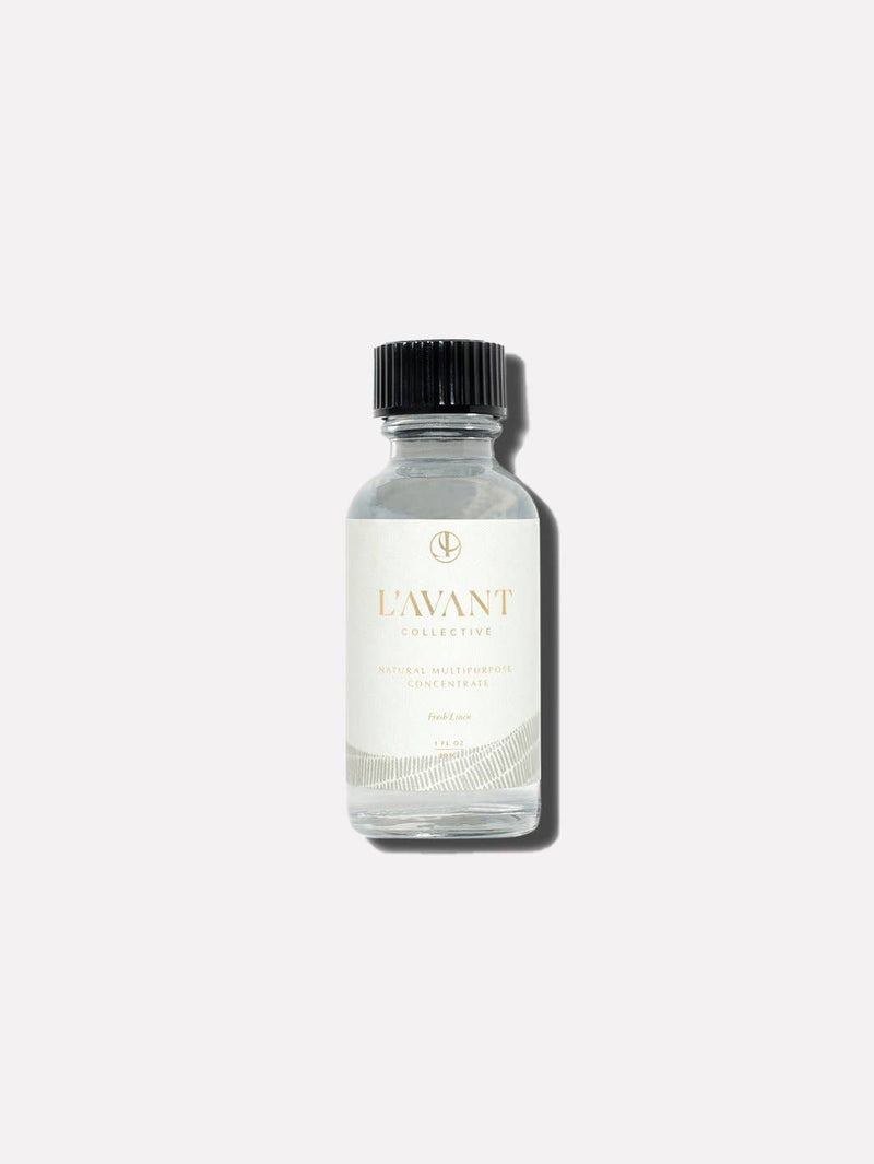 L'AVANT Collective - Fresh Linen Multipurpose Cleaner Refill in a clear glass bottle with black cap, designed for eco-friendly cleaning solutions.