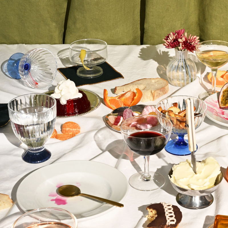 ATELIER SAUCIER - Tinsel Cocktail Napkins | Set of 4, displayed on a festive table with drinks, snacks, and elegant dishware.