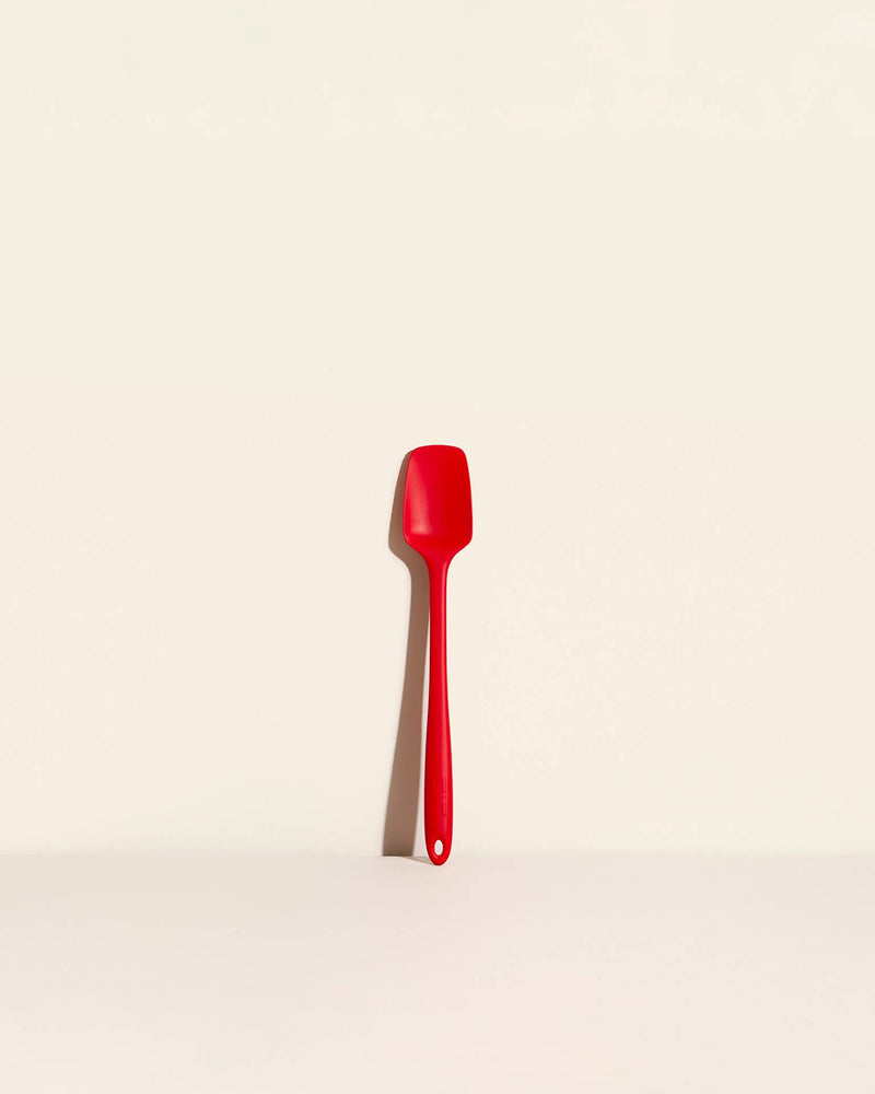GIR Get It Right - GIR Skinny Spoonula: Red, a versatile silicone utensil with a deep bowl and flexible edge, ideal for precise scooping and scraping in the kitchen.