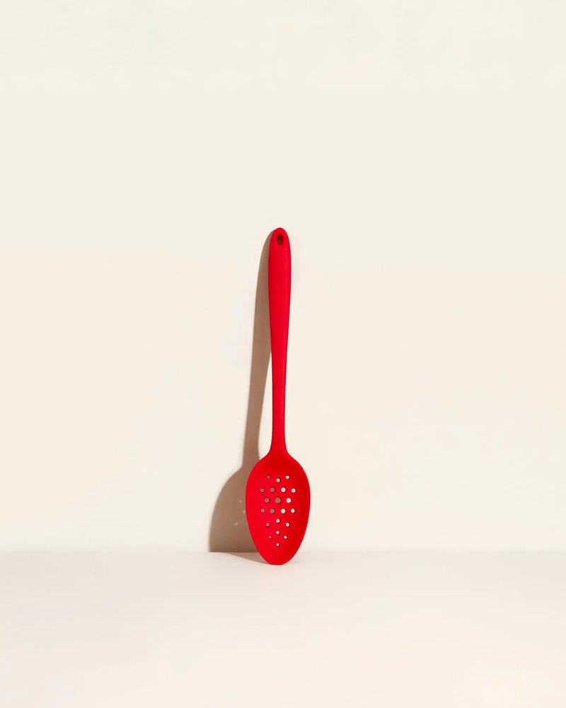 GIR Get It Right - GIR Perforated Spoon: Red, featuring a branching hole pattern for efficient straining, shown on a white surface. Ideal for precise skimming and stirring.