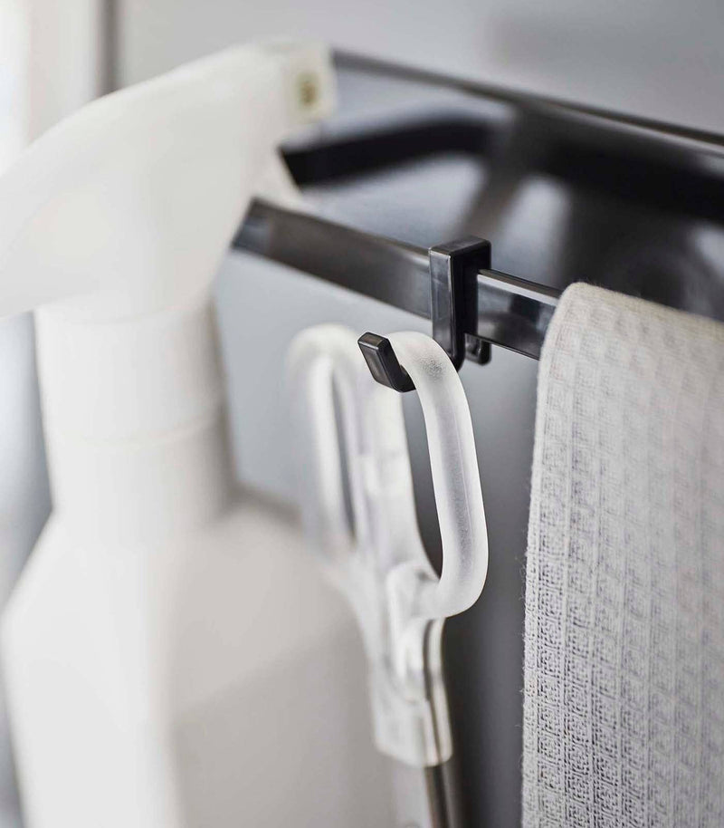 Yamazaki Home - Magnetic Kitchen Towel Hanger: A compact organizer with hooks for tools and towels, ideal for decluttering kitchen spaces.