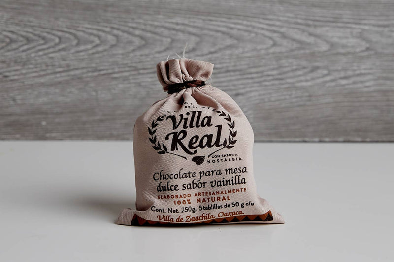 Villa Real Mexican Hot Chocolate: Vanilla / Small - 5 Discs, artisanally crafted in Oaxaca, with cocoa butter, sugar, almonds, and spices. Comes in a branded draw-string pouch.