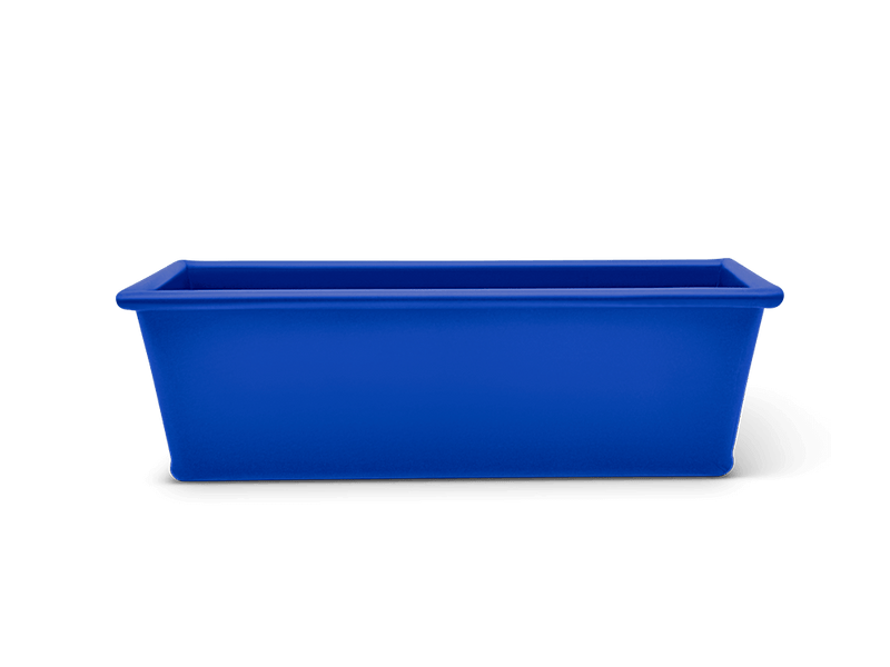 Great Jones | Breadwinner - Raspberry loaf pan with corrugated bottom, designed for nonstick baking and easy release, ideal for ensuring perfect banana bread.