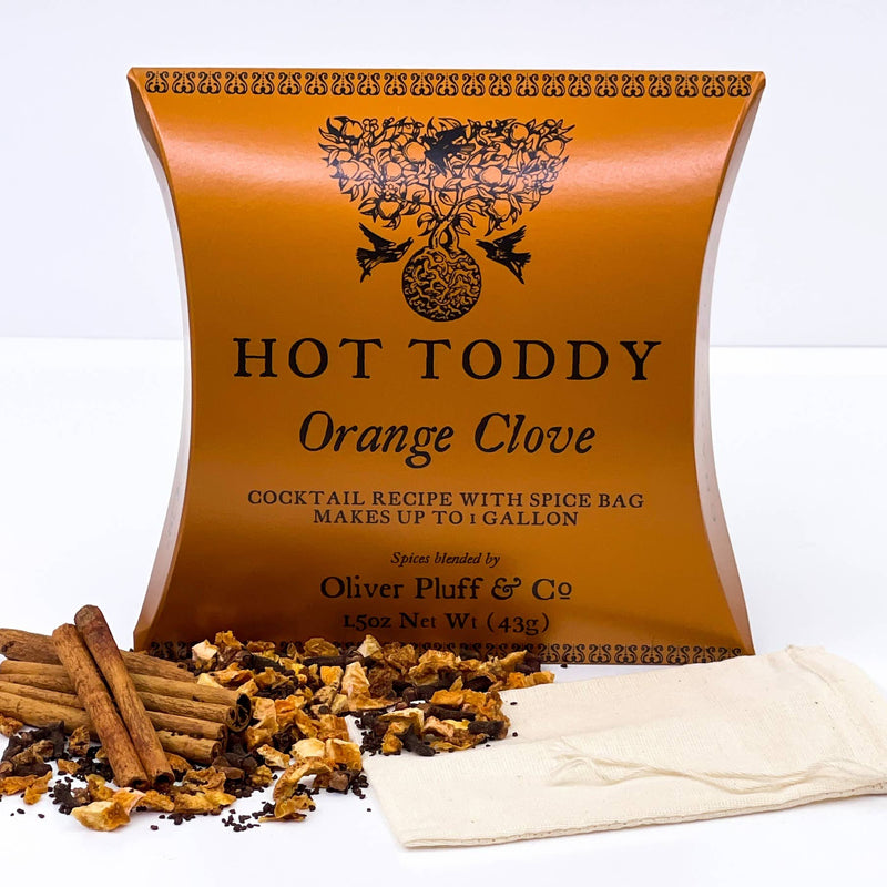 Oliver Pluff & Company - Orange Clove Hot Toddy 1 Gallon Kit, featuring cinnamon sticks, dried orange peel, cloves, and a muslin spice bag for brewing.