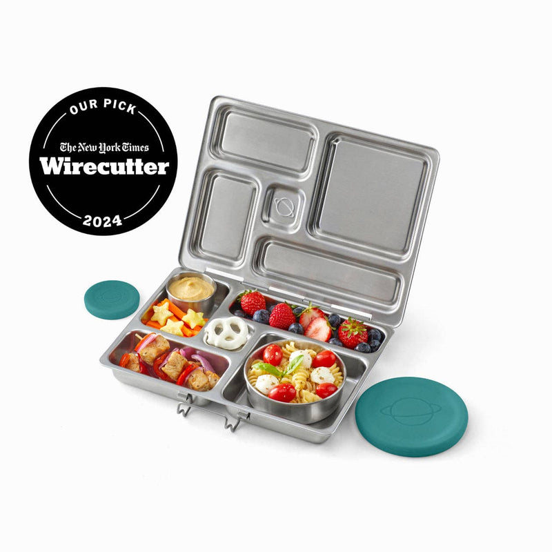PlanetBox Rover Lunch Box, filled with diverse foods in stainless compartments, highlighting its versatility and compact design, featuring teal silicone lids and a Wirecutter “Our Pick 2024” badge.