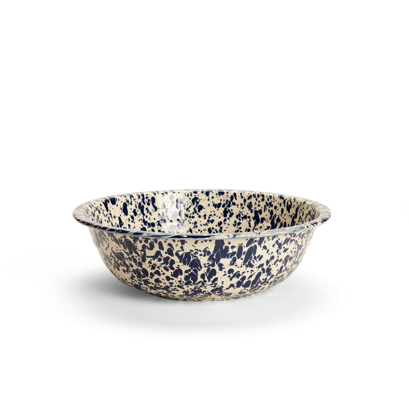 Crow Canyon Home's 4 qt enamelware basin, featuring a blue splatter design, offers durability and versatility for any kitchen task.
