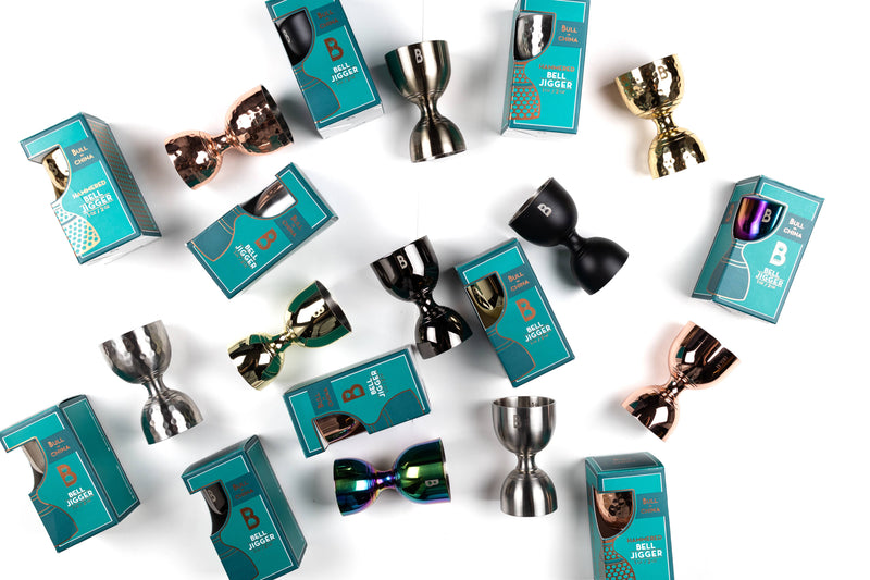 Bull in China | Bell Jigger - Silver: Close-up of a silver jigger, showcasing its ergonomic design and precise internal markings for versatile cocktail measurements. Ideal for home or professional bars.