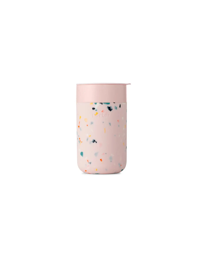 Reusable Ceramic Mug with Pink Lid, featuring a BPA-free splash-resistant lid and non-slip silicone sleeve for easy sipping. Ideal for sustainable home brewing.