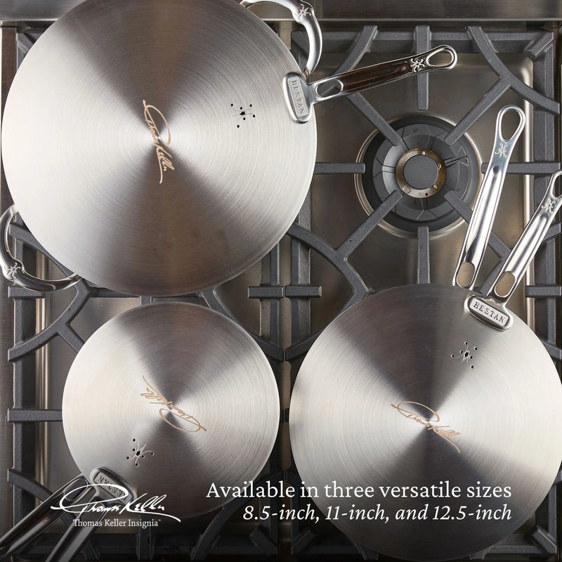 Hestan Provisions | Commercial Clad Stainless Steel Universal Lids, 8.5 Inches, shown on a gas cooktop. Available in 8.5, 11, and 12.5-inch sizes.