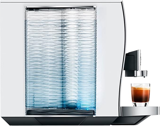 Jura Z10 - Fully Automatic Espresso + Coffee Machine with glass of liquid, showcased in a kitchen setting, ideal for Athens Cooks' curated kitchen collection.