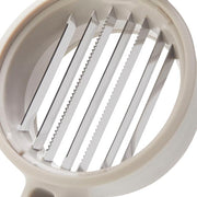 Chef'n FreshForce Handheld Slicer with circular design, featuring dual serrated blades for slicing mushrooms, strawberries, and more efficiently without knives.