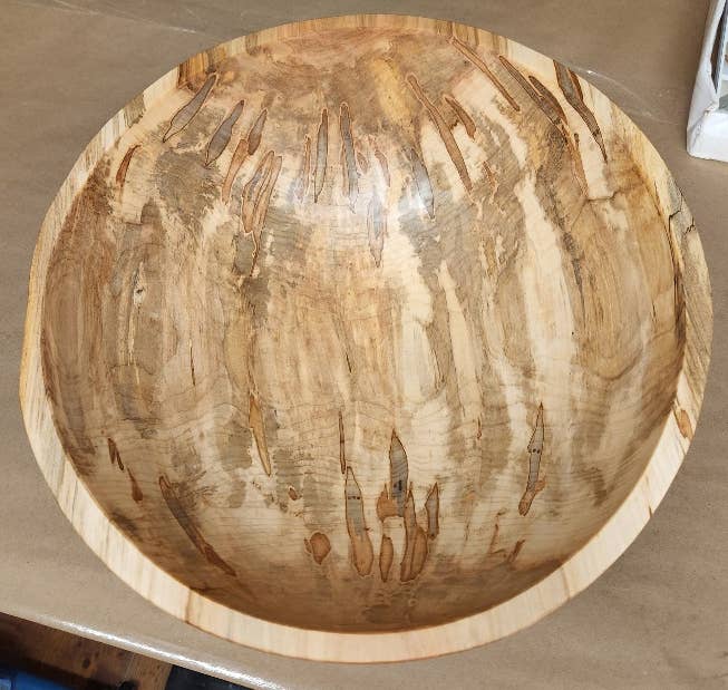 Petermans Boards and Bowls Inc. - 15 Ambrosia Maple Round Bowl, showcasing unique beetle patterns, sustainably handcrafted, perfect for serving in style.