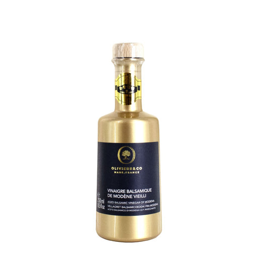 Oliviers&Co | Aged Balsamic Vinegar of Modena in a distinctive gold bottle with a black label, ideal for culinary enthusiasts at Athens Cooks.