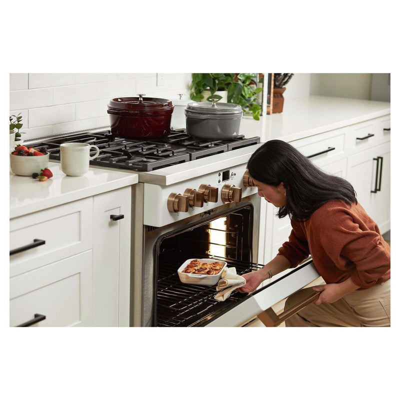 Staub Round Cocotte, 4 qt, Grenadine: A versatile cast iron pot with self-basting lid, perfect for slow-cooking and serving from kitchen to table.