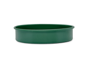 Great Jones | Patty Cake - Broccoli, featuring a wavy, corrugated bottom for easy release, crafted from nonstick ceramic for even baking. Oven and dishwasher safe.