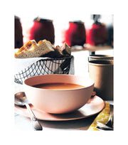 Fable New York | Bamboo Plates & Dinnerware - Cereal Bowl (Set of 4) - Sunsets, held in hand with soup, showcasing eco-friendly bamboo fiber craftsmanship.