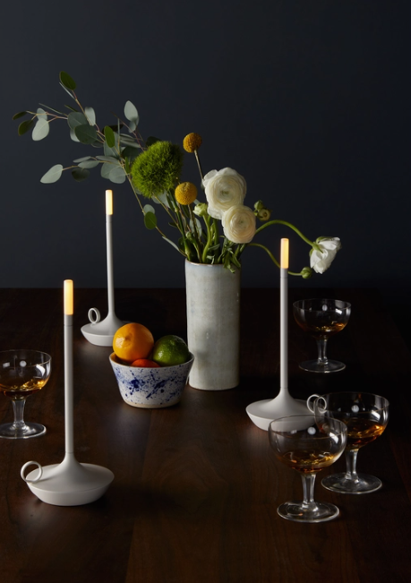 VANMOKUM | GRAYPANTS Wick Portable Rechargeable Lamp on a table, designed for ambient lighting, combining candle romance with flashlight utility. Ideal for intimate or bustling environments.