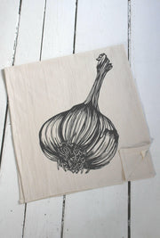 Hearth and Harrow | Organic Cotton Garlic Tea Towel features a detailed garlic bulb drawing, hand-printed on a sustainable, eco-friendly cotton fabric.