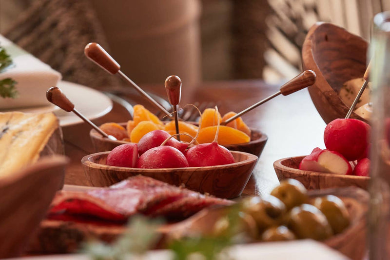 Verve Culture - Italian Olivewood Aperitivo Bowls set with radishes, olives, apricots, salami, and cheese, showcasing artisanal craftsmanship from Umbria for elegant appetizer presentation.