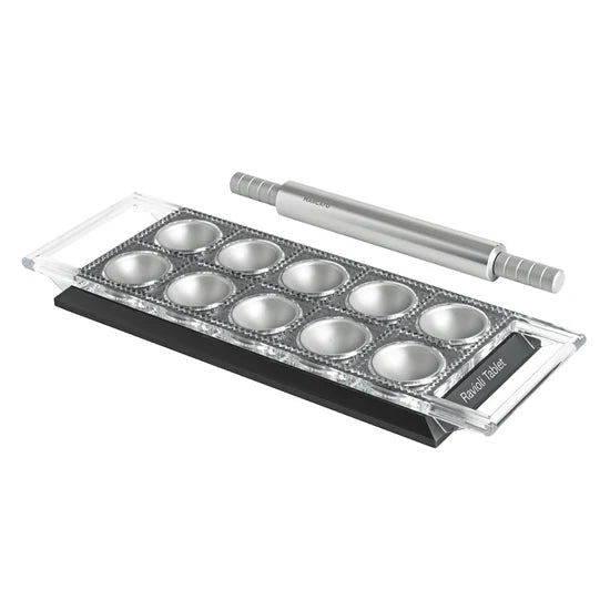 Marcato | Ravioli Tablet Pasta Makers (Red), a silver and black tool for forming and sealing ravioli, shown on a baking tray.