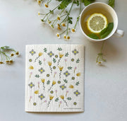 Wildflowers Swedish Dishcloth by Ink and Fiber Designs, featuring lemon and mint accents, ideal for eco-friendly kitchen cleaning with high absorbency.