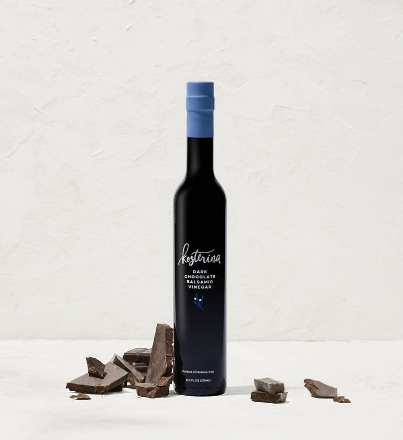 Kosterina - Dark Chocolate Balsamic Vinegar (375ml) bottle next to chocolate pieces, highlighting its rich, velvety flavor profile.