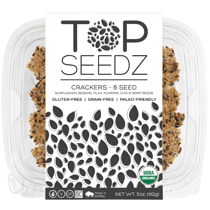 Top Seedz - 6 Seed Crackers (Grain-Free) in a clear plastic container, showcasing the 5oz package with visible crackers and product logo.