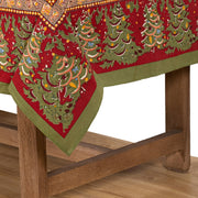Couleur Nature - Noel Red & Green French Tablecloth: 71 x 71, featuring handprinted festive trees on fine French linen, draped over a wooden bench.