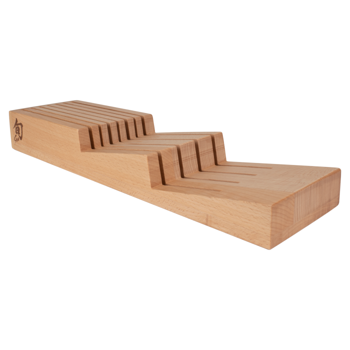 Shun In-Drawer Knife Tray with 7 slots, made of beechwood, featuring parallel grooves to securely store a medium-sized knife collection.