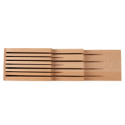 Shun | In-Drawer Knife Tray, 7 Slot, features a beechwood panel with horizontal slots for organizing up to seven kitchen knives neatly in a drawer.