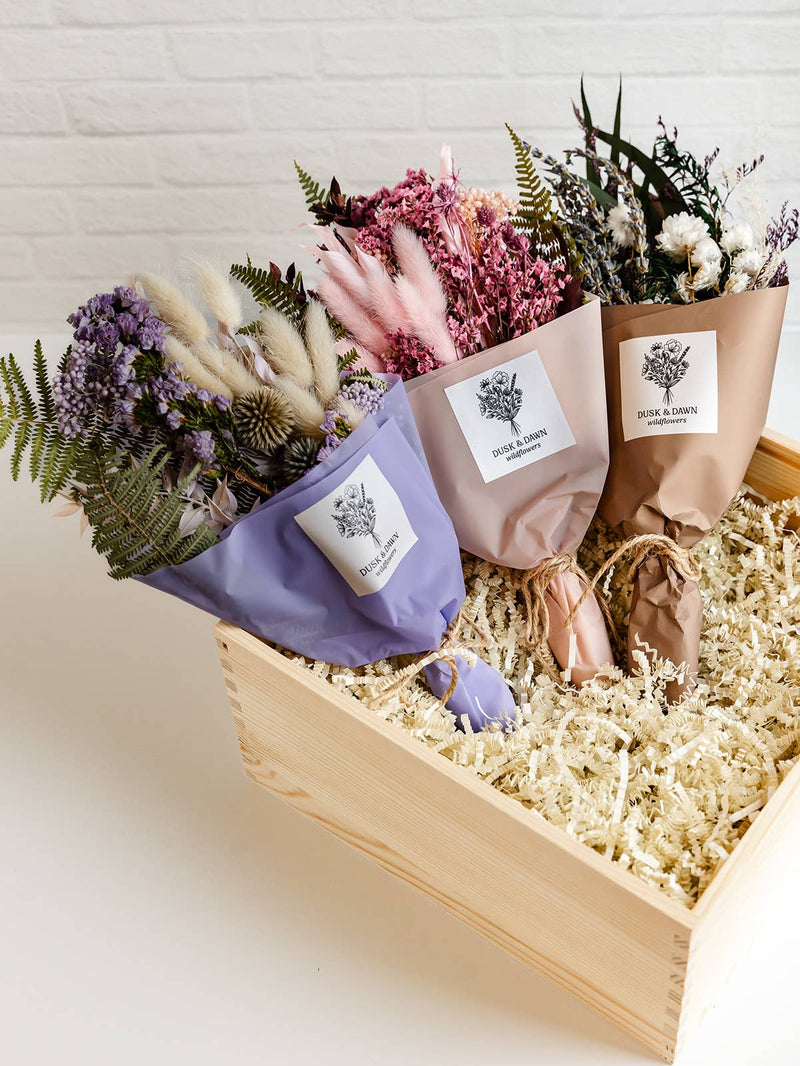 Giften Market - Wooden Gift Box Luxury Pine Keepsake with Lid - 10x10x5, featuring a crafted pine box filled with dried flower bouquets wrapped in pastel paper.